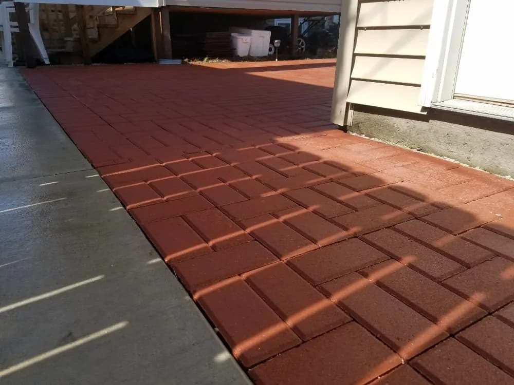 Paved surface bordering a planted area