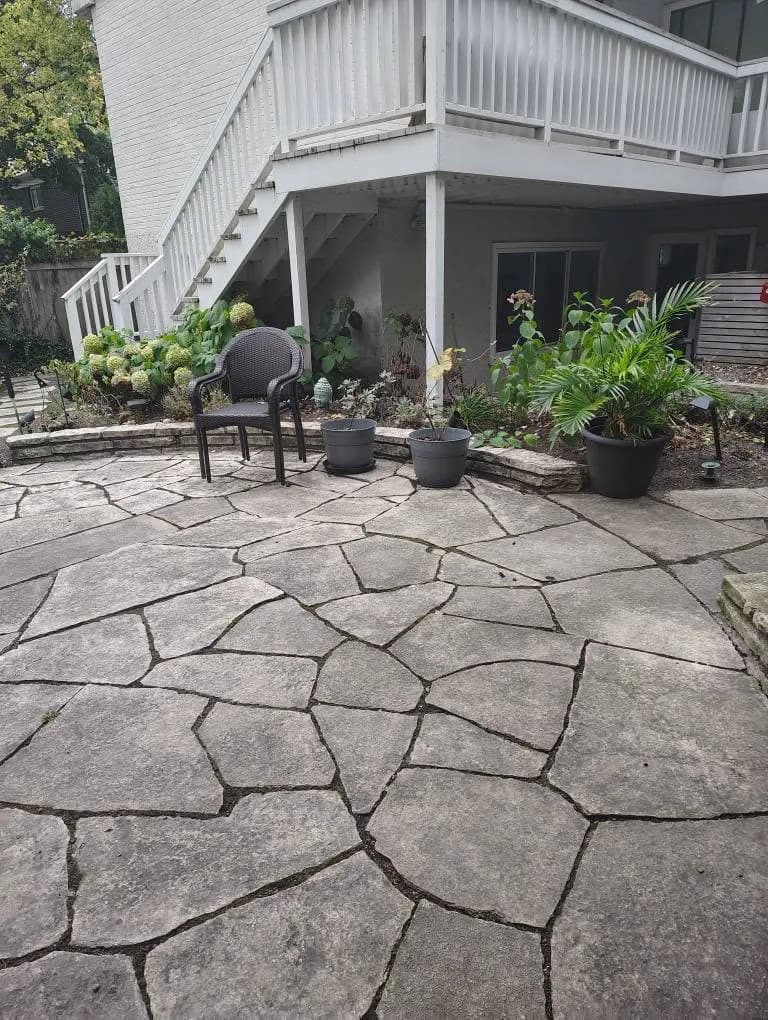 Raised deck over a finished stone patio