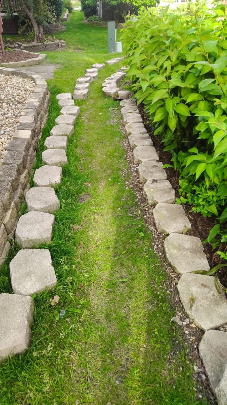 Grass path lined on both sides with set stone edging