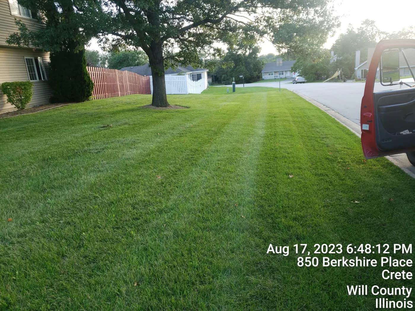 Front lawn mowed with clean stripes